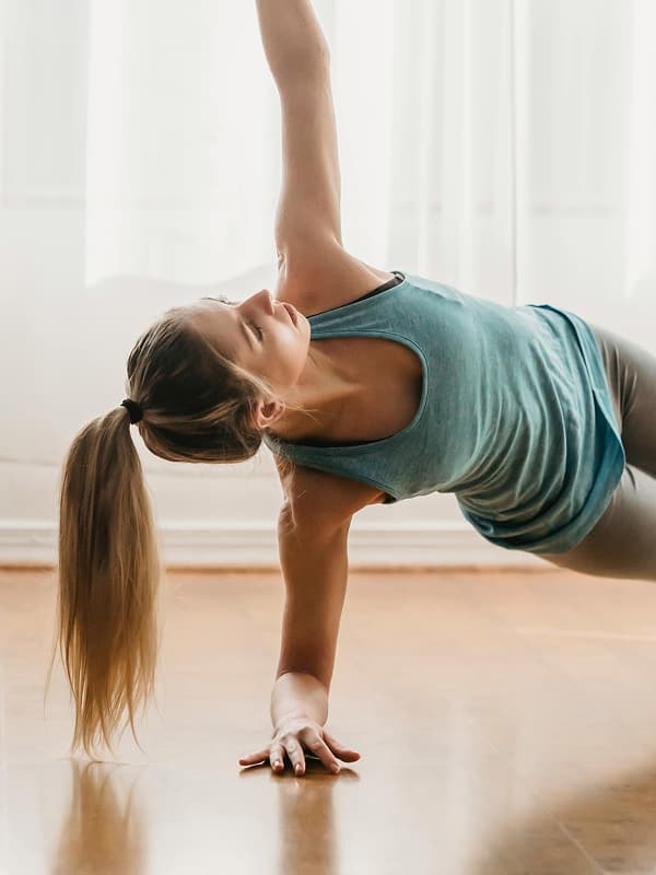 Person doing yoga – symbolizing calm and balance from early retirement planning in Bonsai all-in-one money app