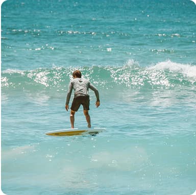 Someone surfing – freedom and confidence from building savings with Bonsai all-in-one money app