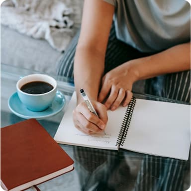 Person writing on paper – smart tax optimisation using Bonsai affordable investing app